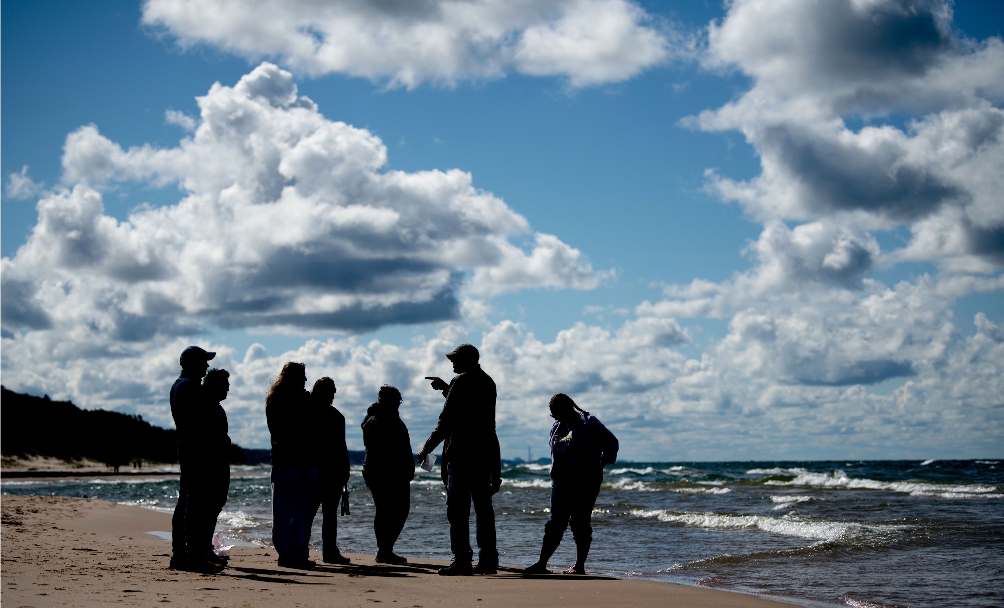 People standing with a blue sky in the background